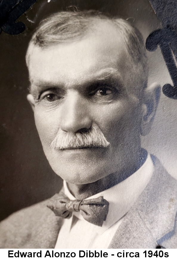 Black and white photo of Edward Alonzo Dibble, a dapper old gentleman with sparse greying hair, thick white moustace, light-colored suit jacket and bow tie.
